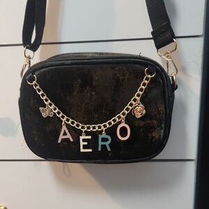 Aeropostale Black Crossbody Bag with Gold Chain and Charms